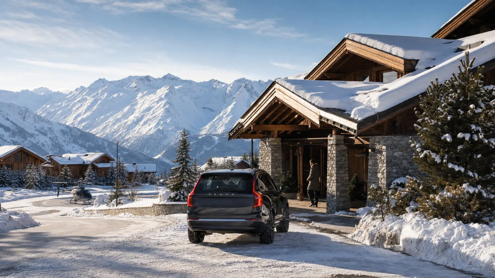 Luxury alpine transfer arriving at a snowy Courchevel chalet with the French Alps in the background