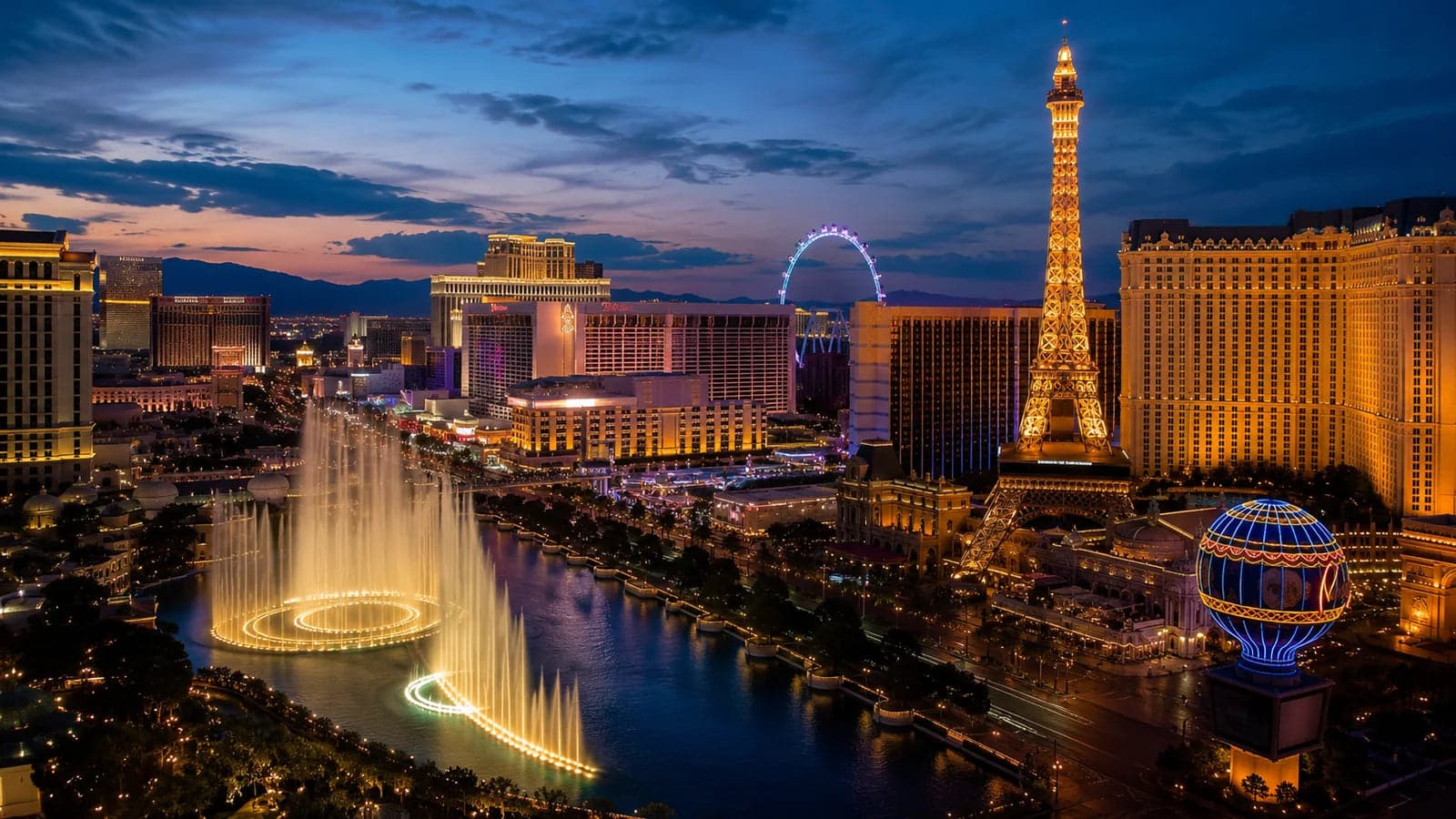 Las Vegas Strip illuminated at blue hour with fountains and skyline