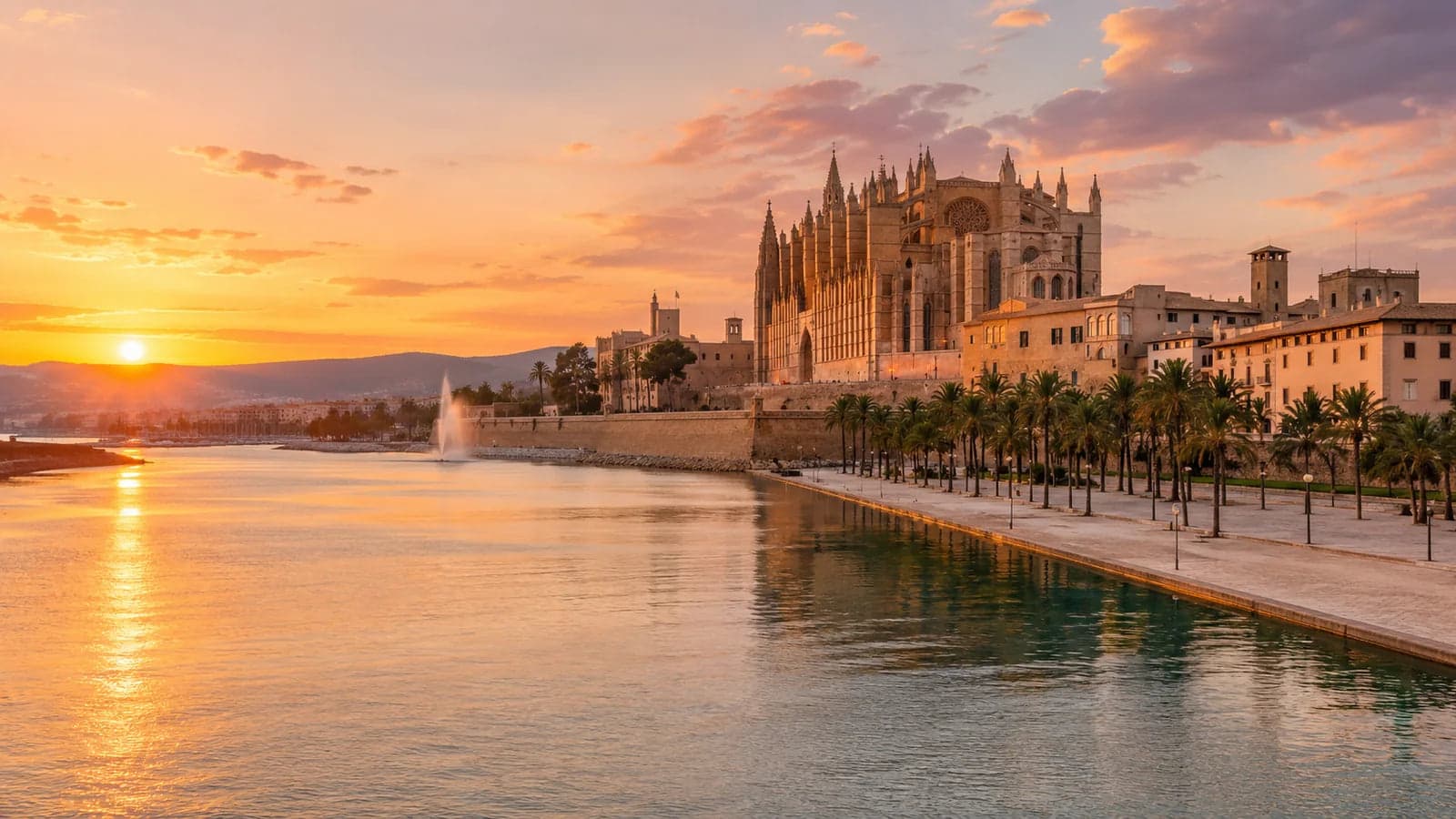 Palma de Mallorca waterfront and La Seu Cathedral at sunset