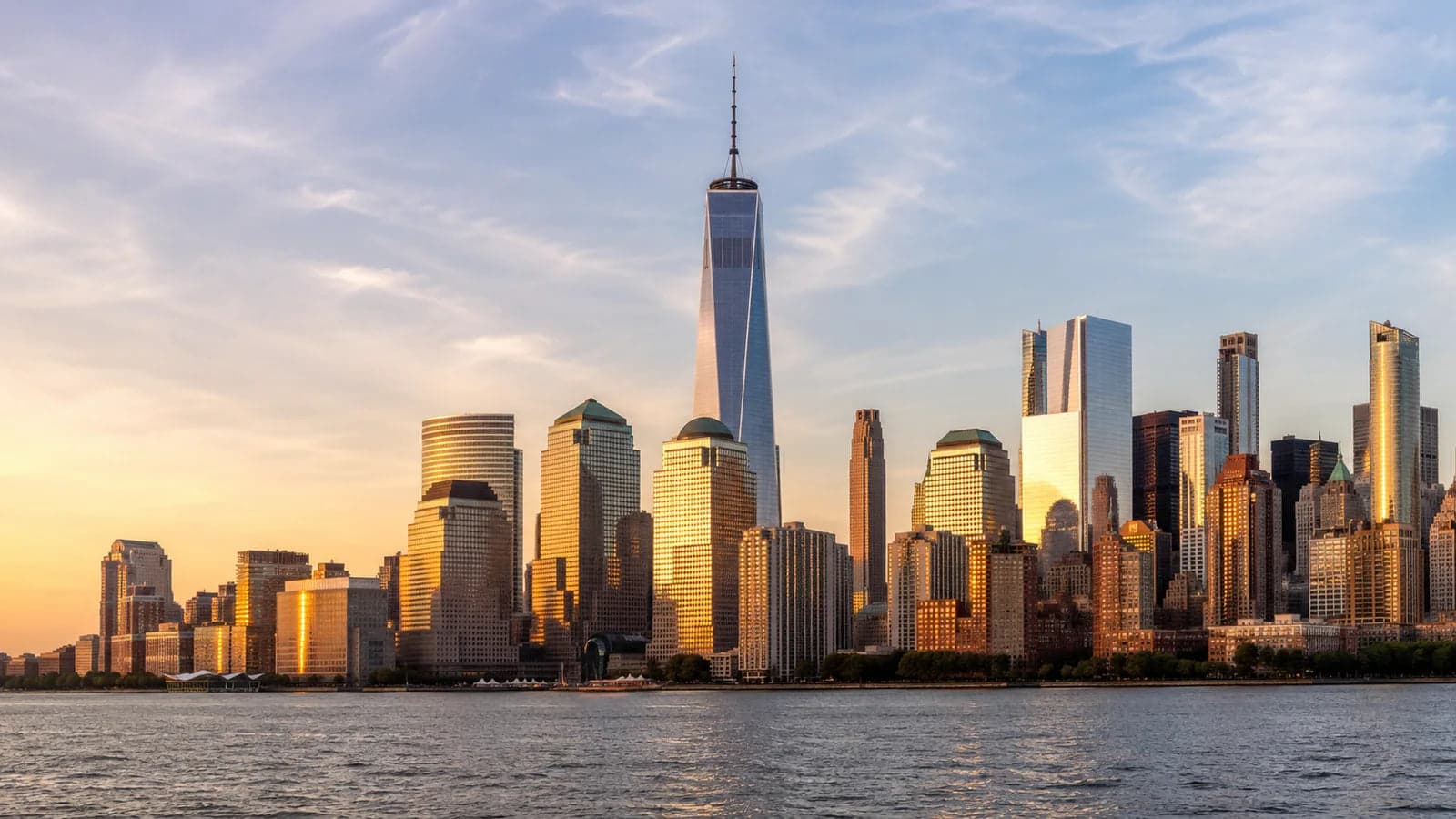 Lower Manhattan skyline and One World Trade Center at golden hour