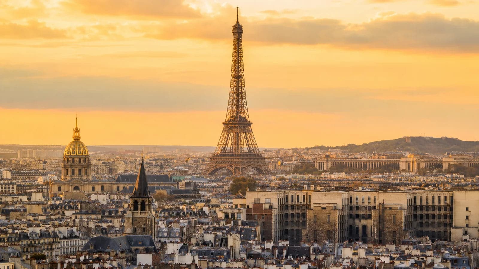 Paris skyline with the Eiffel Tower in warm golden-hour light
